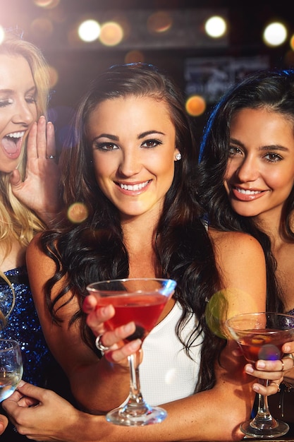 Women cocktail drink and party with smile in portrait friends on night out for new year celebration in nightclub Alcohol drinking glasses and happy with cocktails happy hour and ladies night