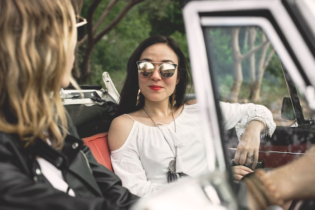 Women Couple Driving a Car Road Trip Together