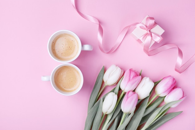 Photo women day 8 march concept morning coffee gift box and spring tulip flowers on pink pastel backgrou