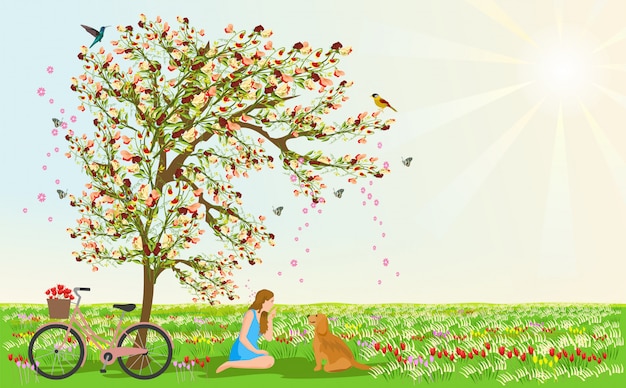 Women and dogs sit under the flower tree