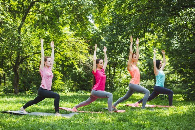 Women doing exercises outdoors