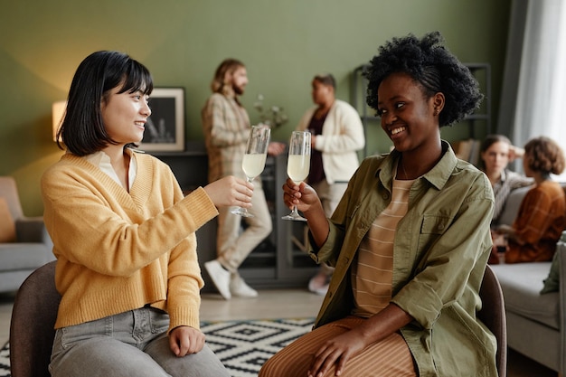 Women drinking champagne at party