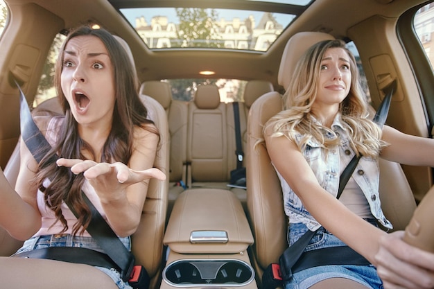 Women driving car in heavy traffic jam