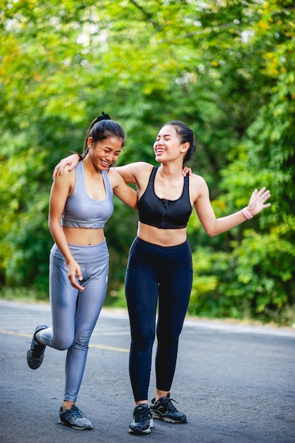 Women exercise happily for good health. Exercise concept