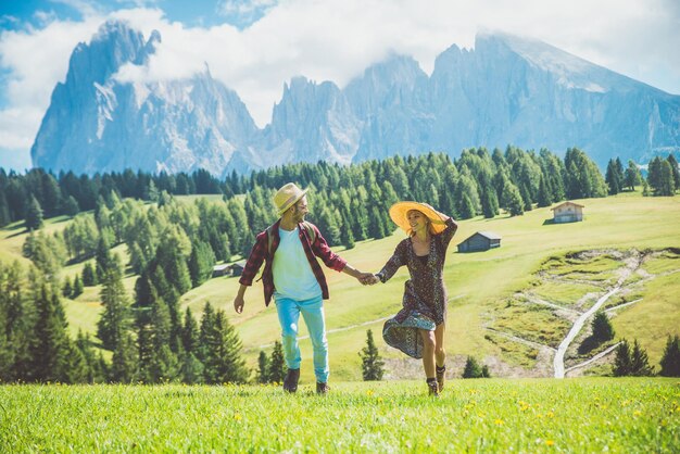 Women on field against mountains