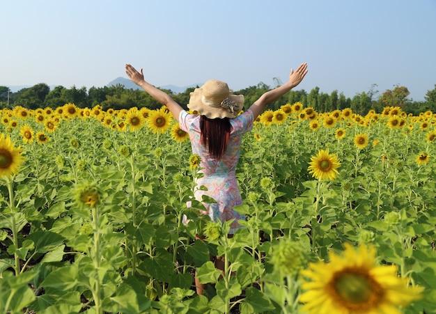 women in field of sunflowers