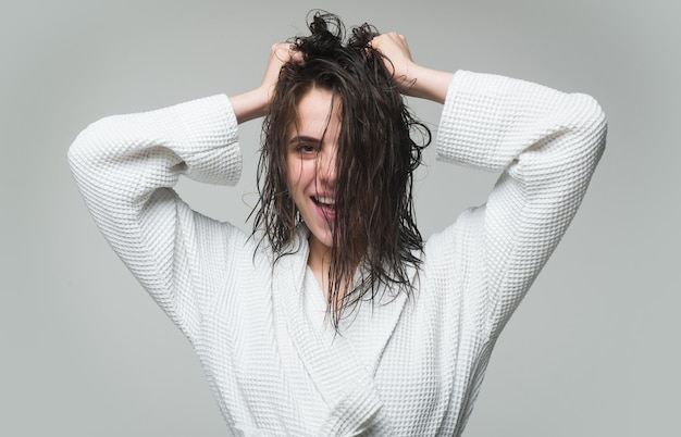 Women hair care Young brunette woman with nourished long hair studio shot