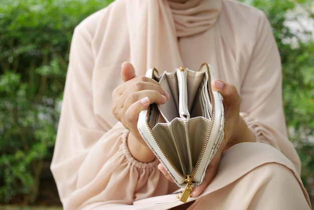 Women hand open an empty wallet