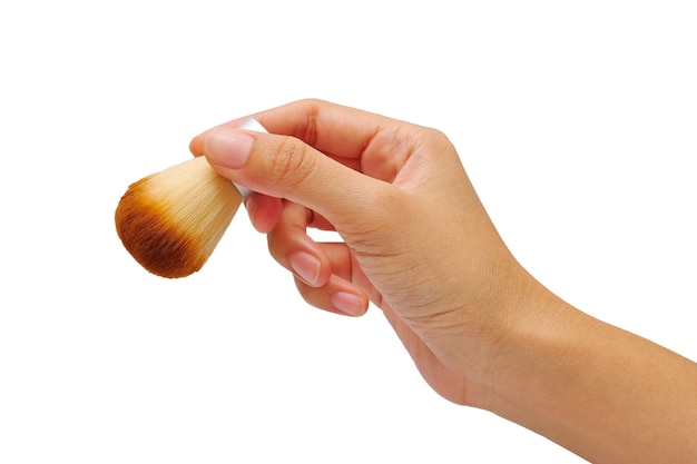 women hand with cosmetic brushes on white background