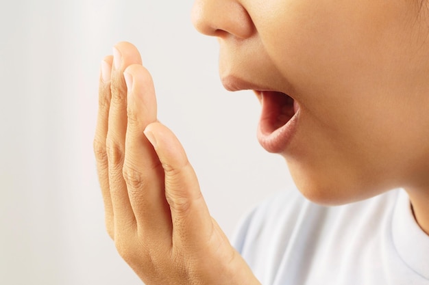 Women have bad breath caused by swollen gums