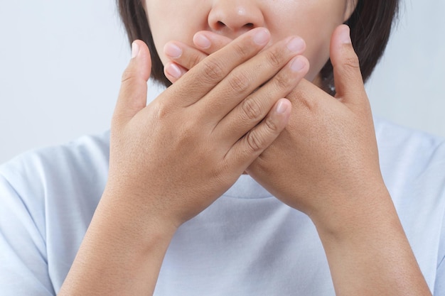 Women have bad breath caused by swollen gums