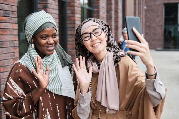 Women having online conversation on the phone