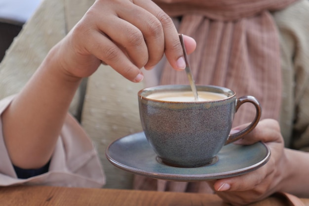 Women holding a coffee cup