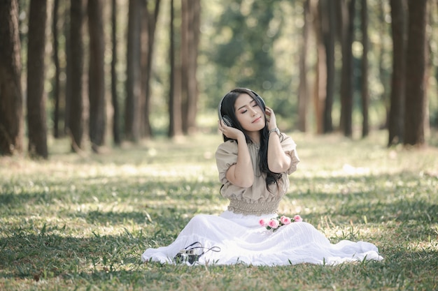 Women listening to music with Bluetooth headset are the most relaxing 