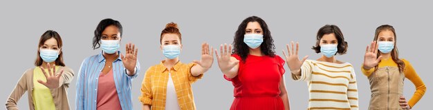 women in medical masks for protection from virus