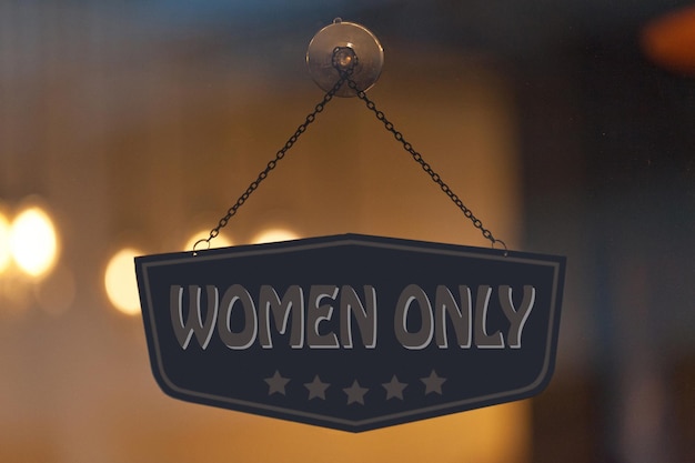 Women only sign in a window