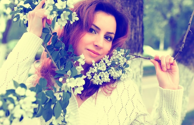 Women in park branch tree flower