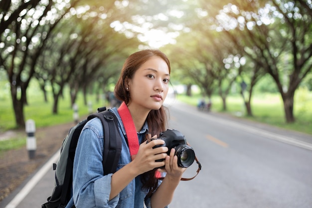 Women photographer holding a camera 