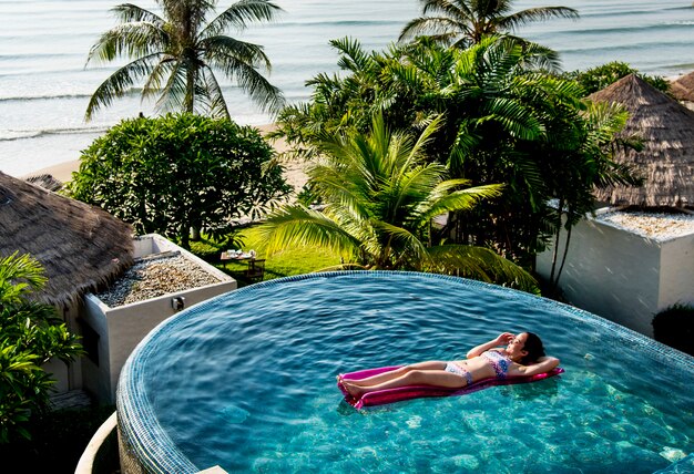 Women on a pool inflatable