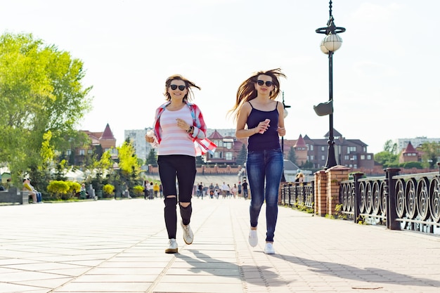 Women running along the road in the park