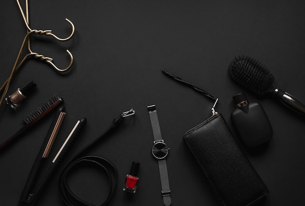 Women's accessories on black background