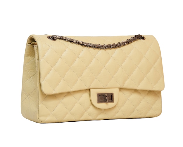 Women's beige leather handbag isolated on white