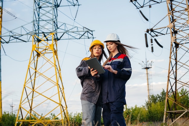 Women's collective of energy workers conducts an inspection of equipment and power lines