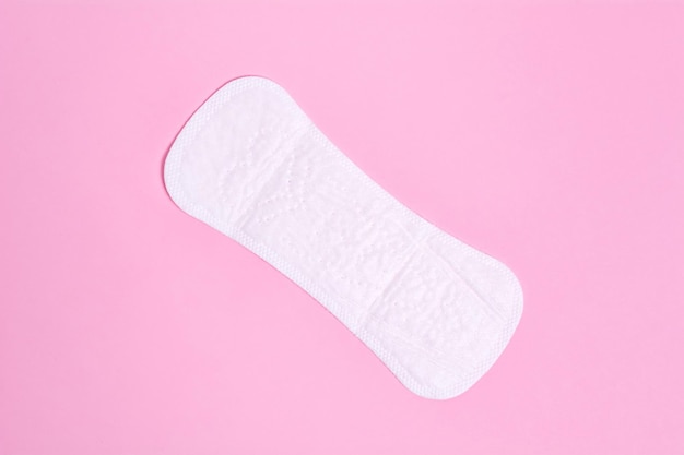 Women's daily panty liner on a pink background Intimate hygiene product