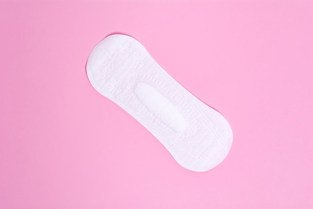 Women's daily panty liner on a pink background