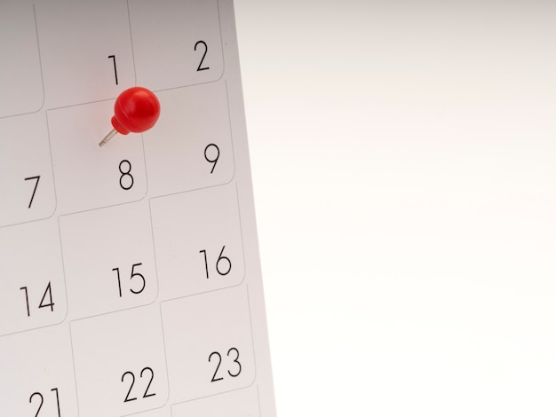 Women's Day on calendar with red pin. 