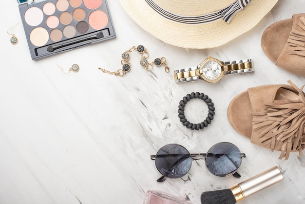 women's fashion accessories and cosmetics flat lay glasses shoes palette lipstick watches powder perfume on a white background