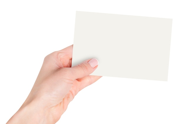 women's fingers holding a blank business card isolated on white background