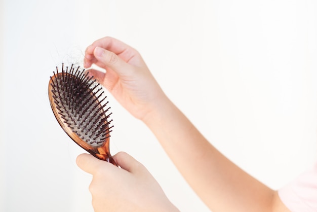 Women's hand hair brush with hair loss