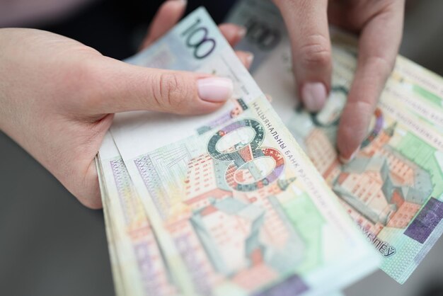 Women's hands are counting cash, close-up, blurry. Ruble banknotes, exchange. Concept devaluation, inflation