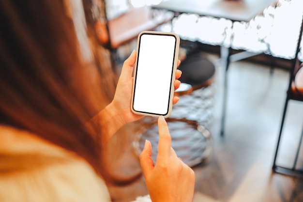 Women's hands holding cell telephone blank copy space screen smartphone with blank white screen isolated on white background smart phone with technology concept