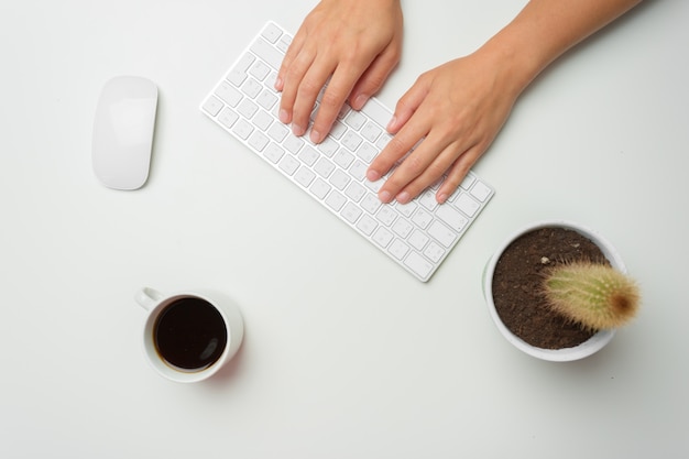 Women's hands using keyboard and mouse