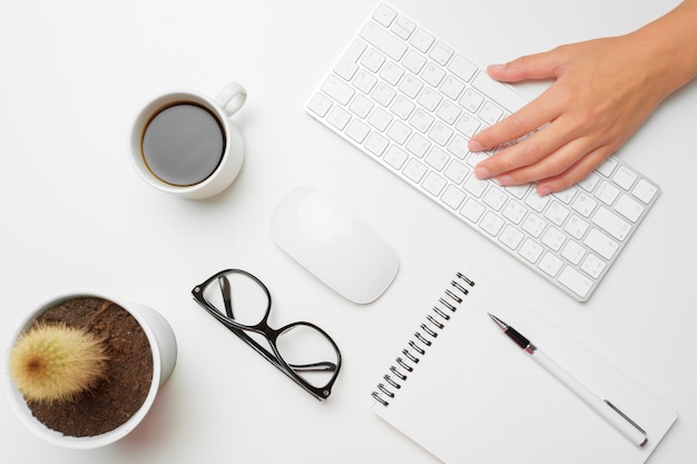 Women's hands using keyboard and mouse