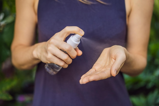 Women's hands using wash hand sanitizer gel