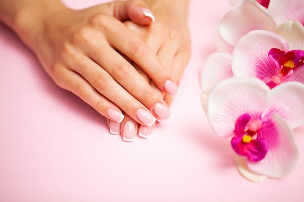 Women's hands with a new manicure.