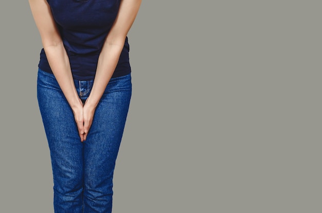 Women's health Pain in the abdomen female organs Silhouette of woman suffering from abdominal pain