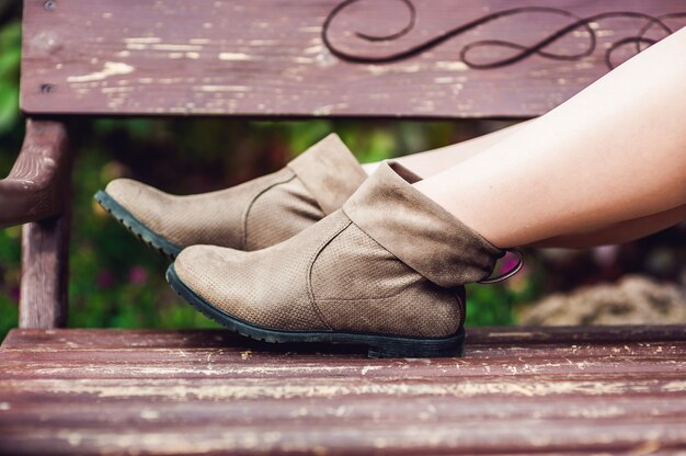 Photo women's legs in leather boots.