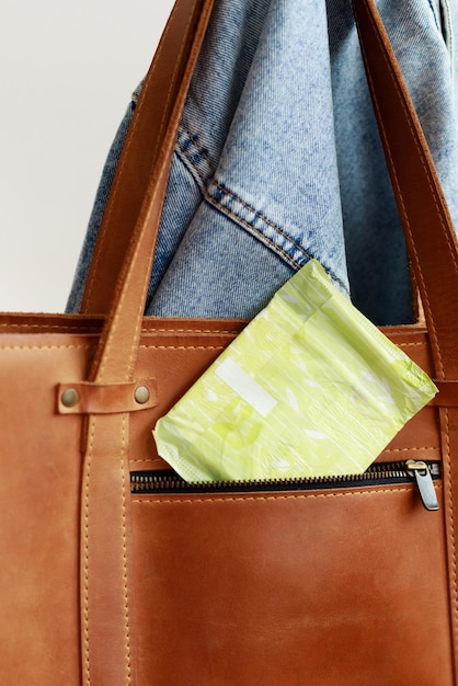 Photo women's pad in the bag close-up. menstruation