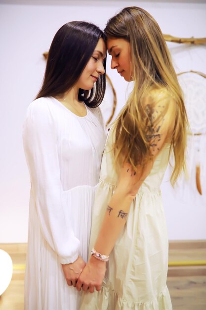 Women's Recovery Group. Diverse Girls Smiling Holding Hands Sitting In Circle Indoor. Selective Focus. Women hug in a women's circle