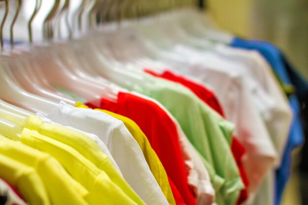 Women's shirts hanging on a hanger in the storec