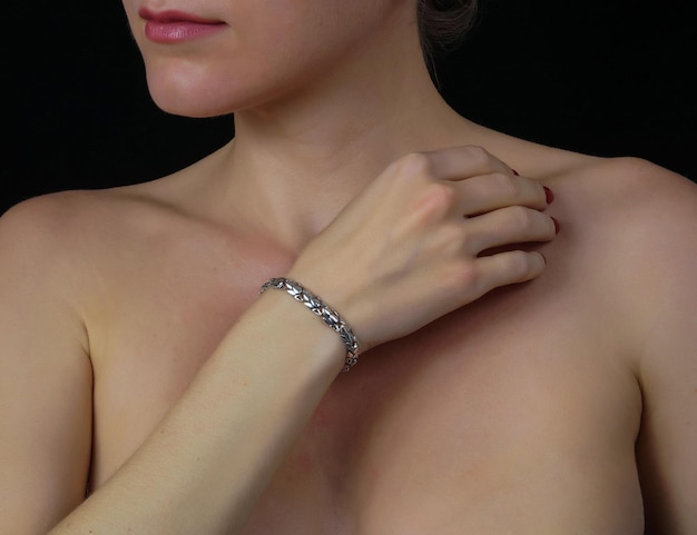 Photo women's silver bracelet on the girl's hand women's accessories jewelry women's jewelry a girl with a bracelet on her arm