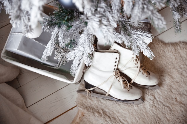 women's skates near Christmas tree