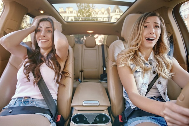 Women sitting in the car after accident on the road