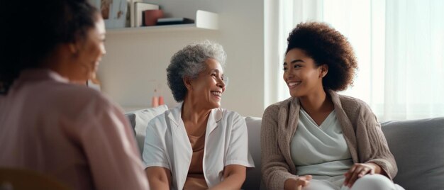 women sitting on a couch one of whom is smiling and the other is smiling