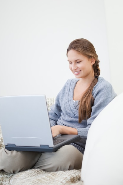 Women sitting while using a laptop