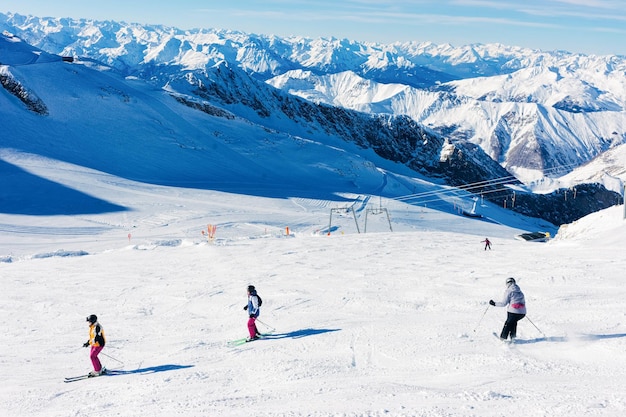 Women Skiers at Hintertux Glacier ski resort in Zillertal in Tyrol. Austria in winter in Alps. Person at Alpine mountains with snow. Hintertuxer Gletscher.